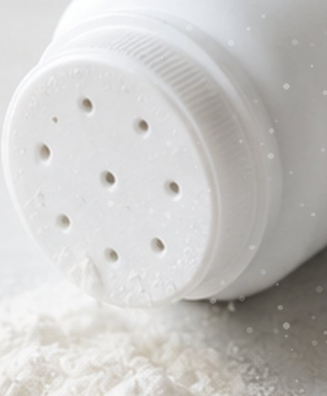 Talcum powder bottle with spilled powder
